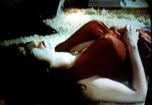 Kellie Everts, third appearance on reality TV show Real People. Seen here laying  breast up on fur rug in her Williamsbirg Brooklyn apartment, in prayer and  mystical contemplation.