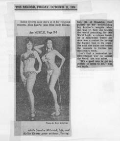 Kellie poses in the press. Two bikini clad babes 'voguing' on stage in body beautiful competition.